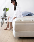 girl sitting on hauz rejuvenate mattress